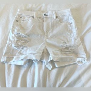 White ripped high rise American Eagle shorts.